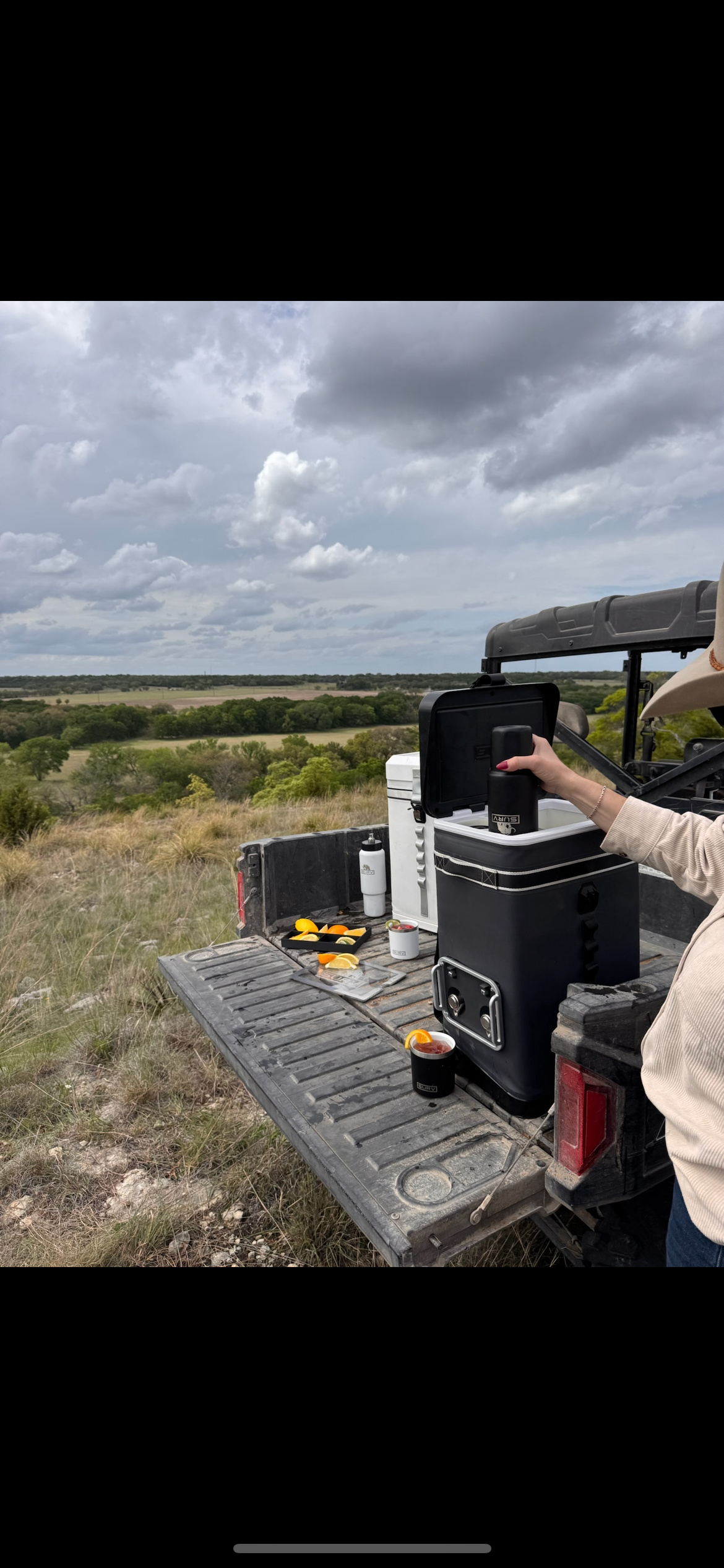 Woman loading a tumbler into a SURV prototype