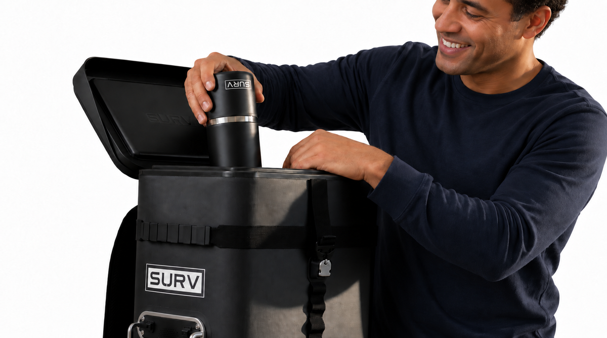 Loading a SURV tumbler upside down into the drink station