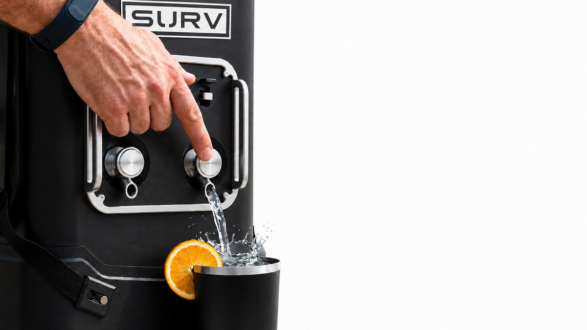 Pushing a SURV tap to pour a drink into a magnetic highball cup
